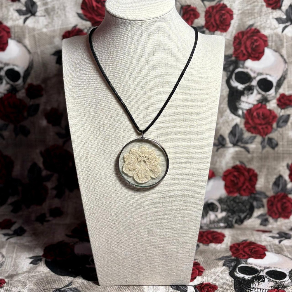 Vintage necklace with ivory lace flower in round glass pendant